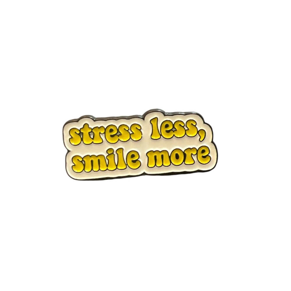 Yellow 'Stress Less, Smile More' enamel pin